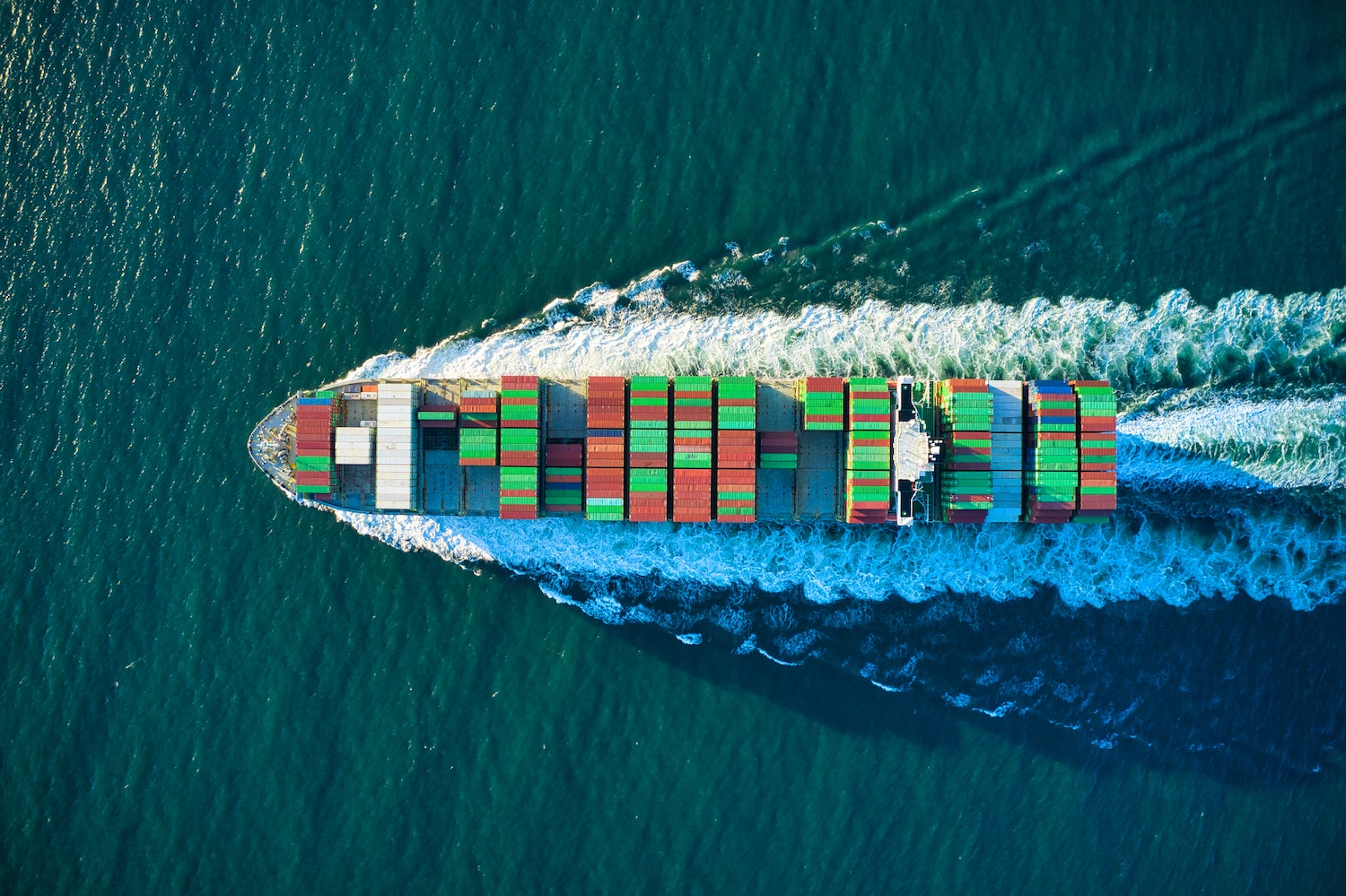 aerial view of a ship with containers